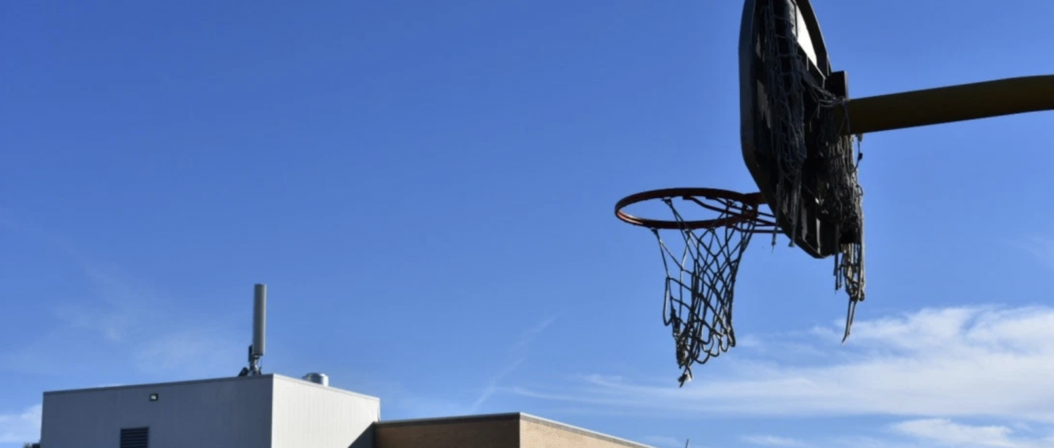 A basketball hoop at Castro Elementary School, in the Westwood neighborhood of Denver. (Jackson Reed, Special to The Colorado Sun)