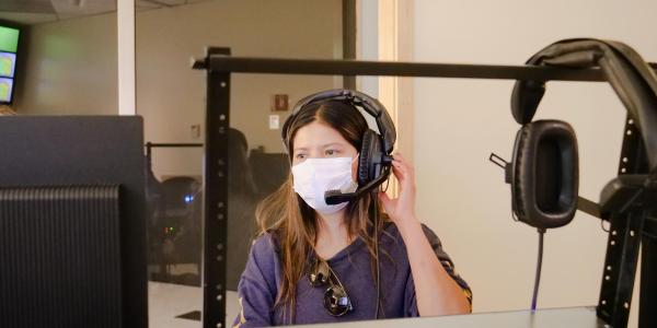 Student behind the scenes in broadcast studio