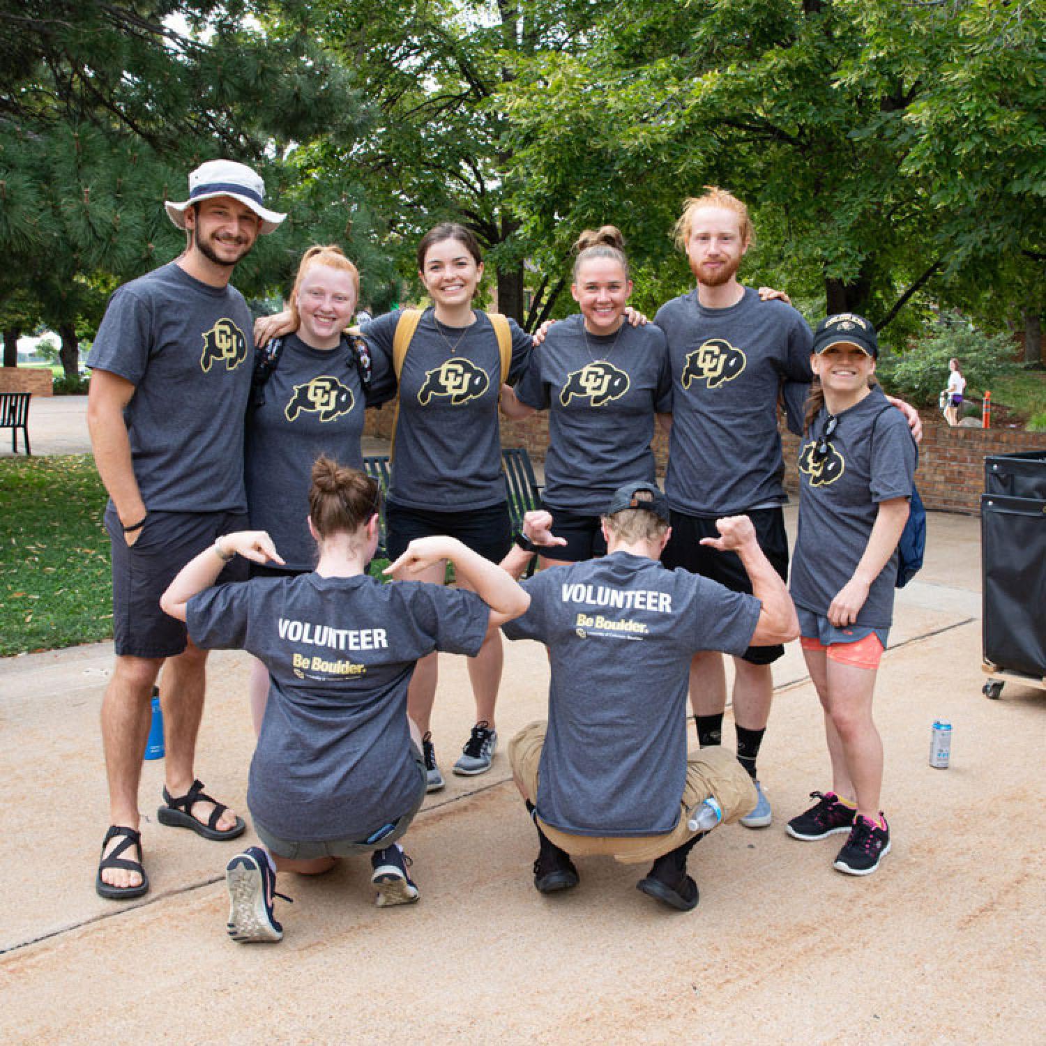 A group of volunteers wearing CU Boulder volunteering shirts