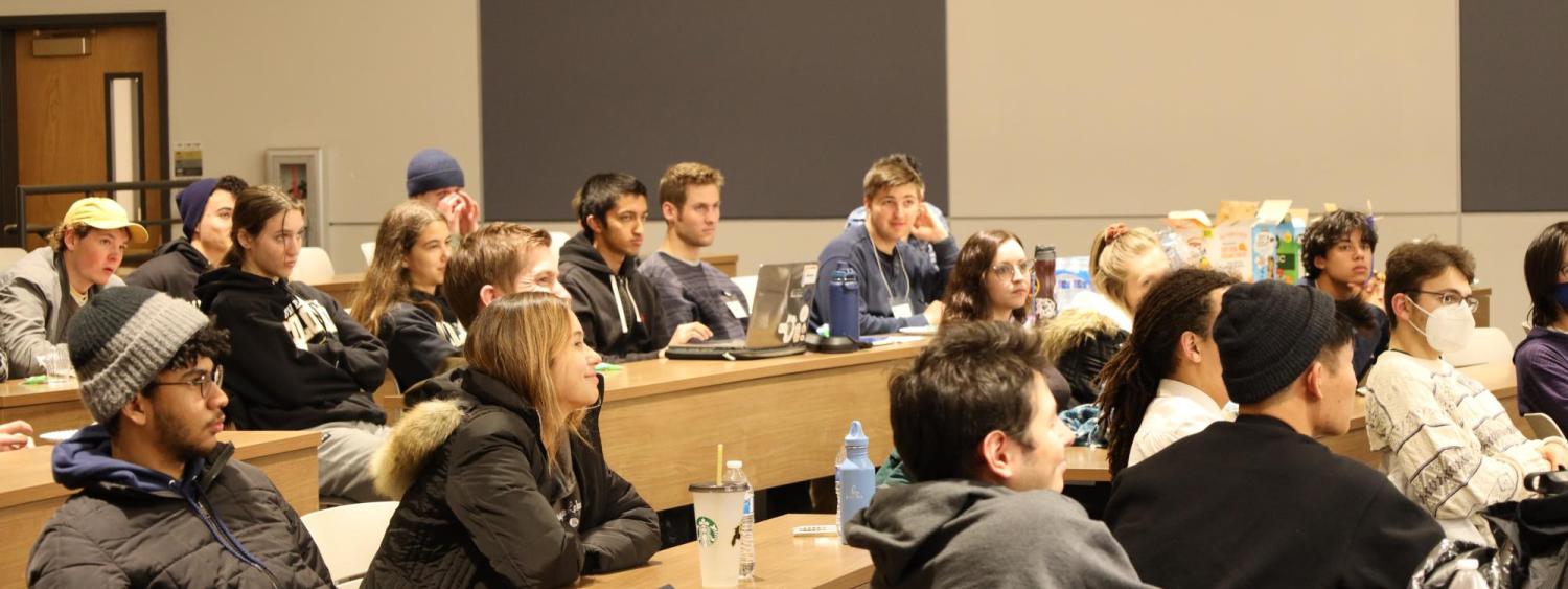 Quantum Scholars students listen to a presentation in a lecture hall