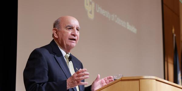 Chancellor Philip P. DiStefano speaks from a lecturn.