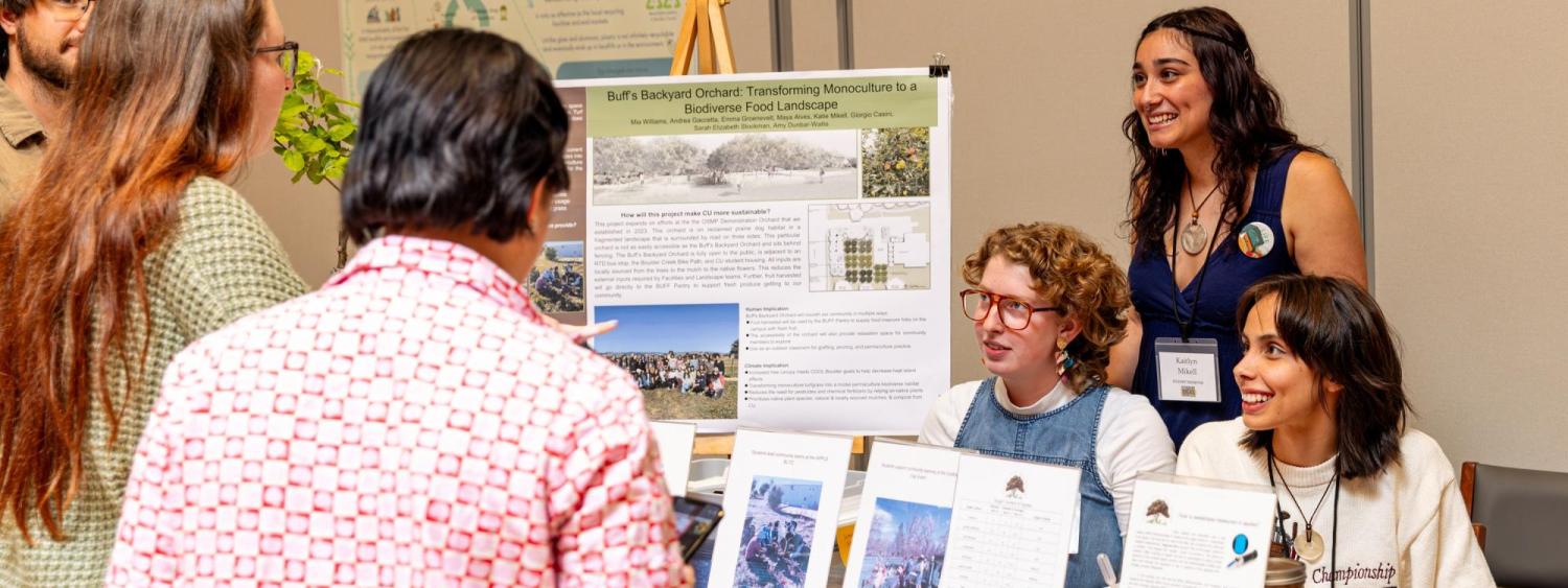 Campus community members visit a booth at the sustainability summit